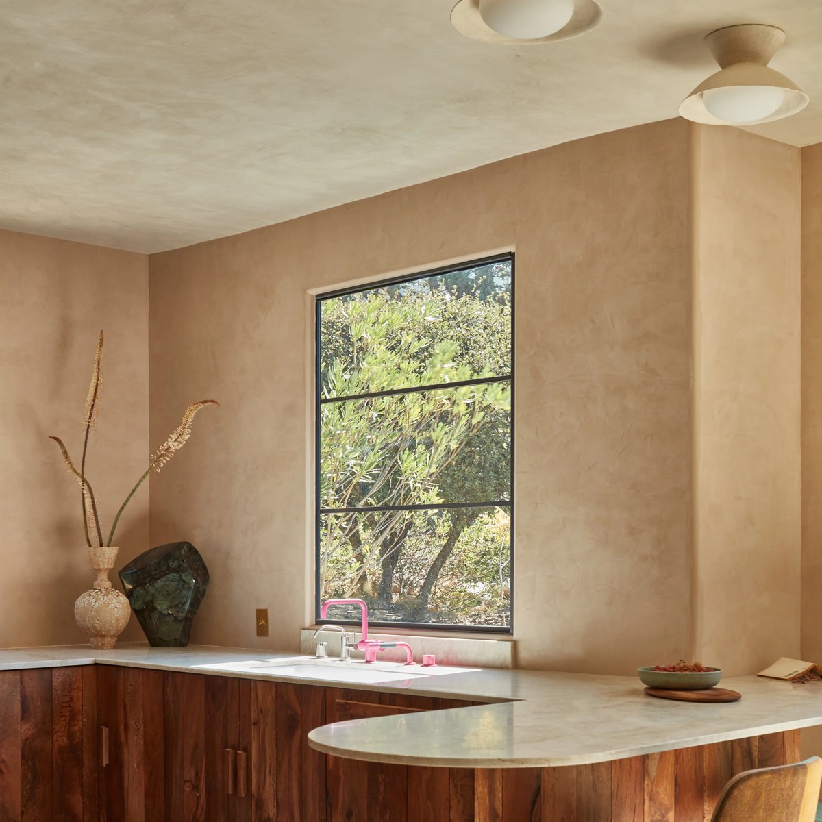 Kitchen with hand-troweled plaster walls and ceiling